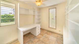 Study at 149 Salters Road with a built-in desk and shelving by louvred windows, Barbados