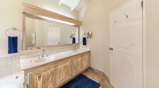 Bathroom with twin basin vanity and large wood-framed mirror, 149 Salters Road, Barbados