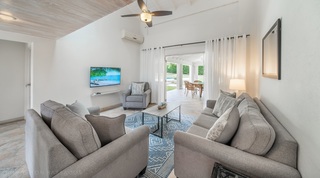 Living room sofas opening to the terrace and dining area at 149 Salters Road villa, Barbados