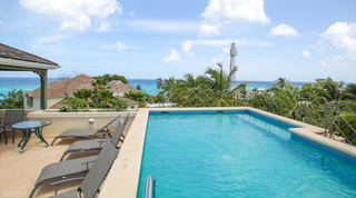 Communal rooftop pool and sun deck with sea views, Beacon Hill 305 – The Penthouse in Barbados