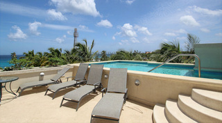 Sun loungers on the rooftop pool terrace at Beacon Hill 305 – The Penthouse, holiday apartments Barbados