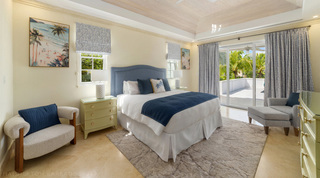 Blue headboard bedroom with sliding doors to the sun terrace at Bella Vista villa, Barbados