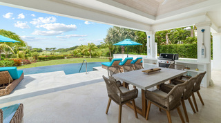 Covered terrace with dining table for eight and barbecue at Bella Vista, Barbados villa rental