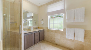 Double vanity and wide framed mirror in an en suite bathroom at Bella Vista, Barbados