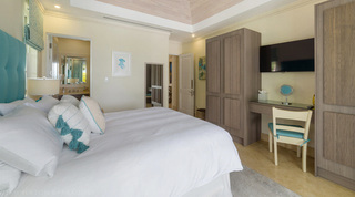 Dressing table and fluted wardrobes in the turquoise bedroom at Bella Vista villa, Barbados