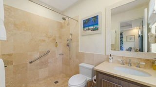 Open wet room shower beside a single basin vanity at Bella Vista, Barbados villa rental