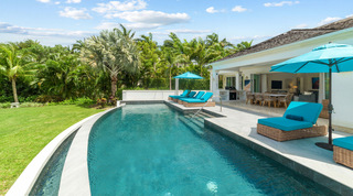 Sun loungers and parasols along the pool deck at Bella Vista, a private villa in Barbados