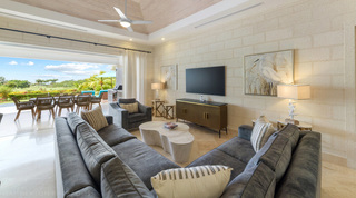 Living room sofas facing the terrace and fairway beyond at Bella Vista villa, Barbados