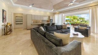 Open-plan living room and kitchen under a timber-clad ceiling at Bella Vista, Barbados
