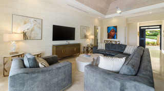 Fluted brass sideboard and starfish table lamps in the Bella Vista living room, Barbados villa rental