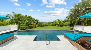 Shallow pool entry looking across the lawn to the golf course at Bella Vista, Royal Westmoreland, Barbados