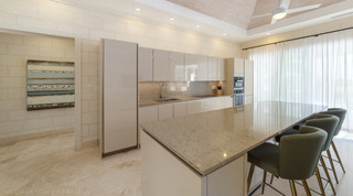 Handleless kitchen cabinetry and speckled worktops at Bella Vista, holiday villa in Barbados