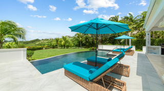 Twin sun loungers facing the lawn and wooded estate views at Bella Vista, Barbados