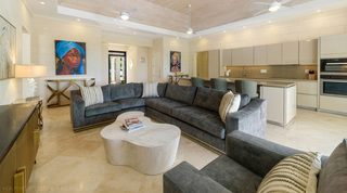 Sectional sofa and sculptural coffee table facing the kitchen at Bella Vista villa, Barbados