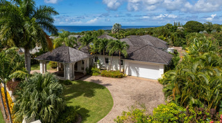 Aerial view over the drive to the Caribbean Sea beyond Carlton Ridge, a holiday villa in Barbados