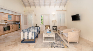 Open-plan living room and kitchen in the self-contained cottage at Carlton Ridge, Barbados