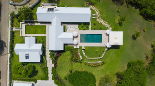 Aerial view over Cloudbreak showing the main house, guest cottage, pool and garden courtyards in Barbados