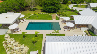 Private pool, gazebo and poolside outdoor kitchen seen from above at Cloudbreak villa in Barbados