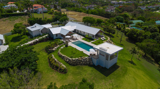 Elevated aerial of Cloudbreak among the St. James villas of Westmoreland, its pool and gardens below, Barbados