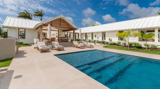 Private pool and teak sun loungers beside the gabled covered terrace at Cloudbreak in Westmoreland, Barbados