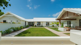 Central courtyard lawn and paved paths between the wings of Cloudbreak villa, Westmoreland, Barbados