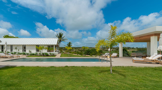 Private pool and covered terraces above the gardens at Cloudbreak, one of the villas in Barbados with ridge views