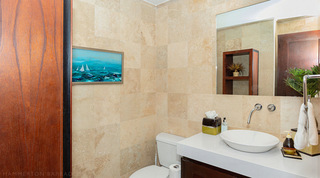 Cloakroom at Coral Cove 14 – Crowsnest in Barbados, with a vessel basin and a painting of sailing yachts