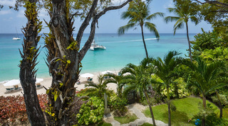 Garden gate and outdoor shower down to the sand at Coral Cove 14 – Crowsnest in Barbados, a catamaran in the bay beyond