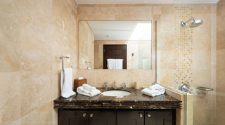 Bathroom with marble vanity and glass walk-in shower at Coral Cove 15 - Penthouse, holiday apartments Barbados