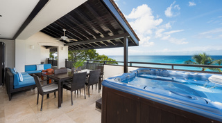 Covered terrace with jacuzzi and alfresco dining overlooking the sea at Coral Cove 15 - Penthouse, Barbados