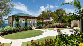 Lawns and flowering borders sweeping to the sea-view loggia and outdoor kitchen, Crystal Springs, Barbados