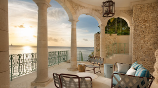Woven seating under coral stone arches facing the low sun, Crystal Springs, holiday villas in Barbados