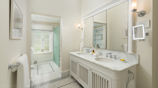 Mirrored cabinets above a marble-topped twin vanity and mosaic floor, Crystal Springs, Barbados