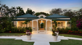 Rendered cottage with coral stone quoins and a white fretwork verandah, Crystal Springs, The Garden, Barbados