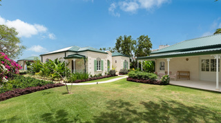 Crystal Springs' rendered buildings with green roofs, coral stone quoins and shuttered arched windows, Barbados