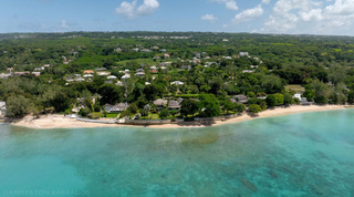 Wide aerial of the sandy shoreline and turquoise waters in front of Four Winds on the west coast of Barbados