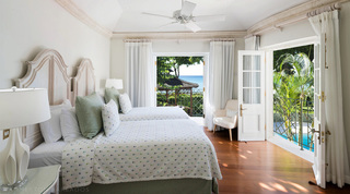 Twin bedroom opening to a terrace with sea and pool views at Four Winds, Gibbs Beach, Barbados