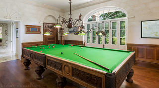 Full-size billiards room with green baize table and wood panelling, Four Winds villa in Barbados