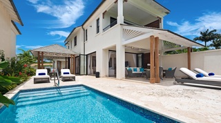 Garden Wall 13, a luxury villa in Apes Hill, Barbados, with a blue-tiled pool and covered terrace