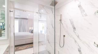 Walk-in glass shower with veined marble walls at Glitter Bay 204 Sea Men's Inn, luxury apartment in St. James, Barbados