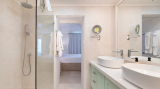 En-suite bathroom with walk-in shower opening through to the bedroom, Glitter Bay 301 – The Lighthouse, Barbados