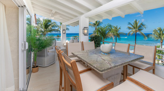 Glitter Bay 301 – The Lighthouse stone-topped terrace table facing the Caribbean Sea, St. James, Barbados
