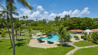 Landscaped resort pool with sun loungers and palm-shaded lawns at Glitter Bay 308, holiday apartment in Barbados