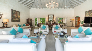 Living room with white sofas, turquoise cushions and antique art at Jamoon villa, Sandy Lane, Barbados