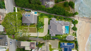 Overhead aerial of Kai villa and plunge pool set just behind beachfront Kaiso, with the sea beyond, Barbados