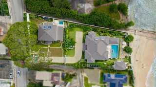 Top-down aerial of Kaiso beside the beach with pool and jacuzzi, neighbouring Kai villa behind, in St. James, Barbados