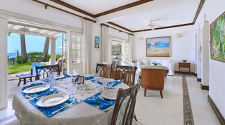 Dining table set for dinner by open garden doors at Mahogany Bay – Chanel No.5, holiday villa, Barbados