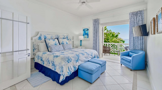 Mahogany Bay – Chanel No.5's blue king bedroom opening to a sea-view balcony in Barbados