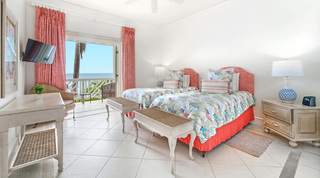 Mahogany Bay – Chanel No.5's twin bedroom with fish-print linens and a sea-view balcony, Barbados