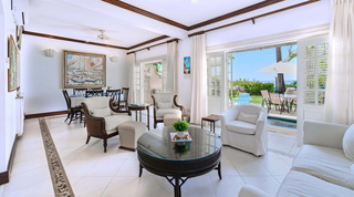 Open-plan living room opening to the pool terrace at Mahogany Bay – Chanel No.5, luxury villa, Barbados